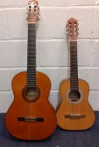 A Narvaez Model 1S 6 string acoustic guitar together with a half sized Jose Ferrer 6 string acoustic