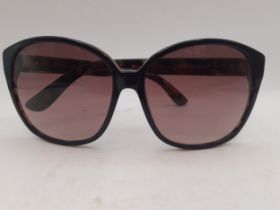 Tods- A pair of brown tortoiseshell effect sunglasses with brown lenses, gold tone branded