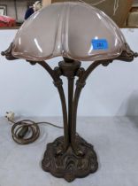 A reproduction metal Art Nouveau style table lamp with pink tinted frosted glass shade Location: