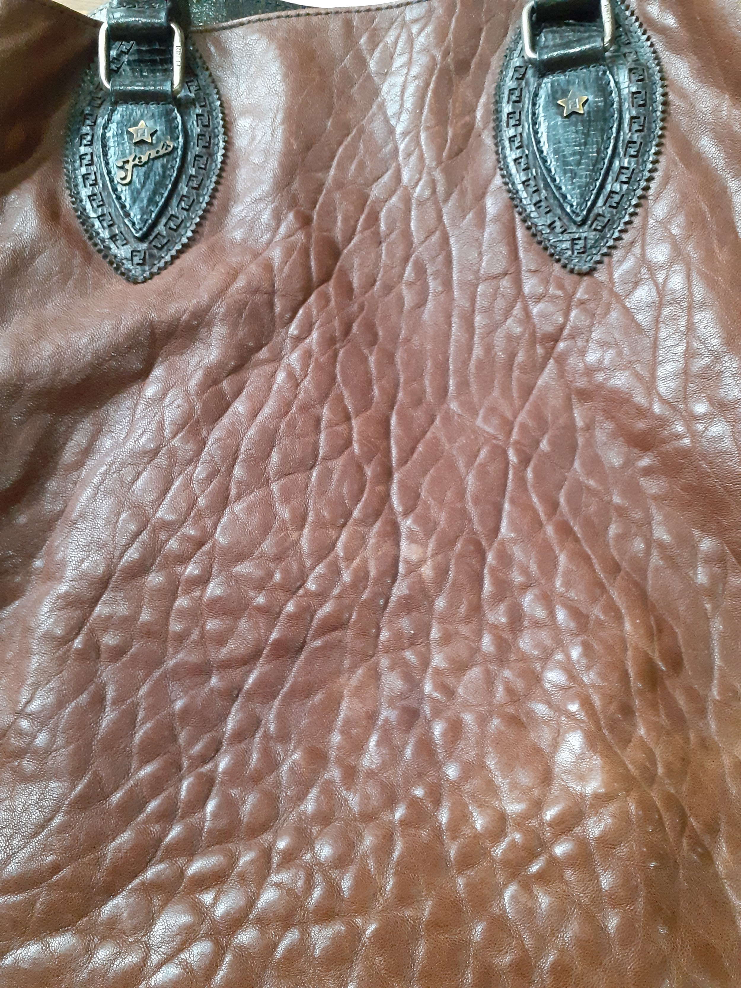 Fendi-A brown leather Selleria boho bag having rolled dark brown leather handles, side pockets, - Image 5 of 6