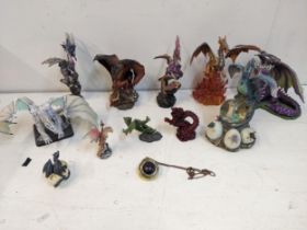Composition dragon models in various poses and colours, along with a pocket watch and chain