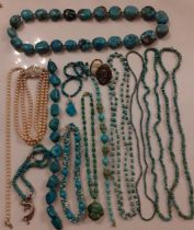 A quantity of vintage turquoise rough-cut and pebble bead necklaces, some with silver claps