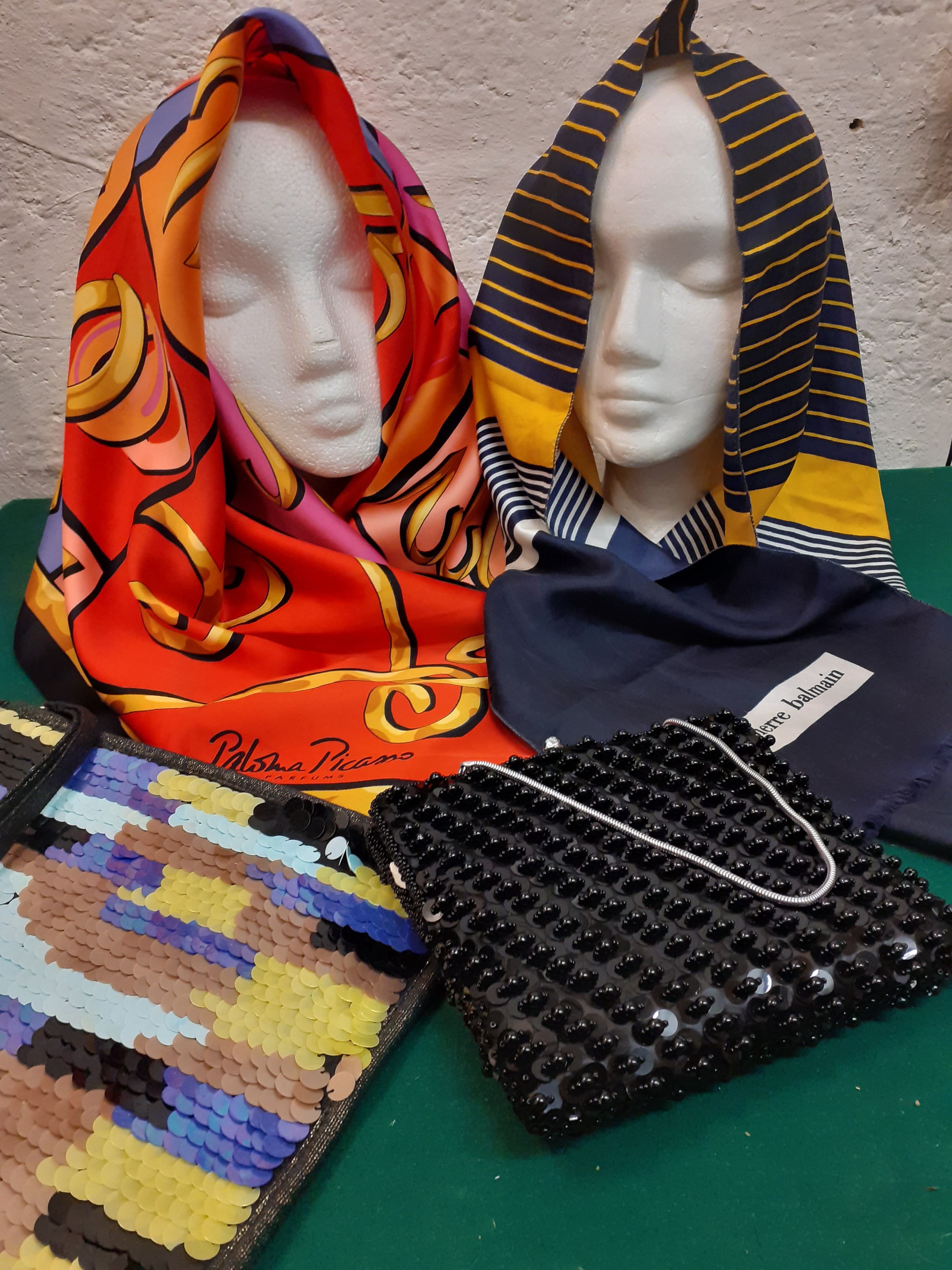 A Paloma Picasso scarf in red, pink, yellow, purple and black together with a Pierre Balmain scarf