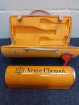 Veuve Clicquot-An orange fabric branded picnic/car case together with an orange metallic case in the