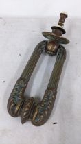 A 19th century bronze door knocker Location: