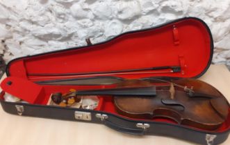 A late 19th century violin, approximately 14.5" from nose to lower bout, together with a bow and