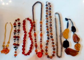 A quantity of vintage necklaces to include amber examples. Location:BWR