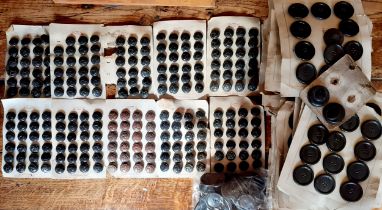 A quantity of 1920's-1950's black and brown buttons, mostly on card to include examples manufactured