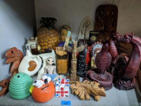 A mixed lot to include a retro pineapple ice bucket, North America Native souvenir art, Rubik's cube