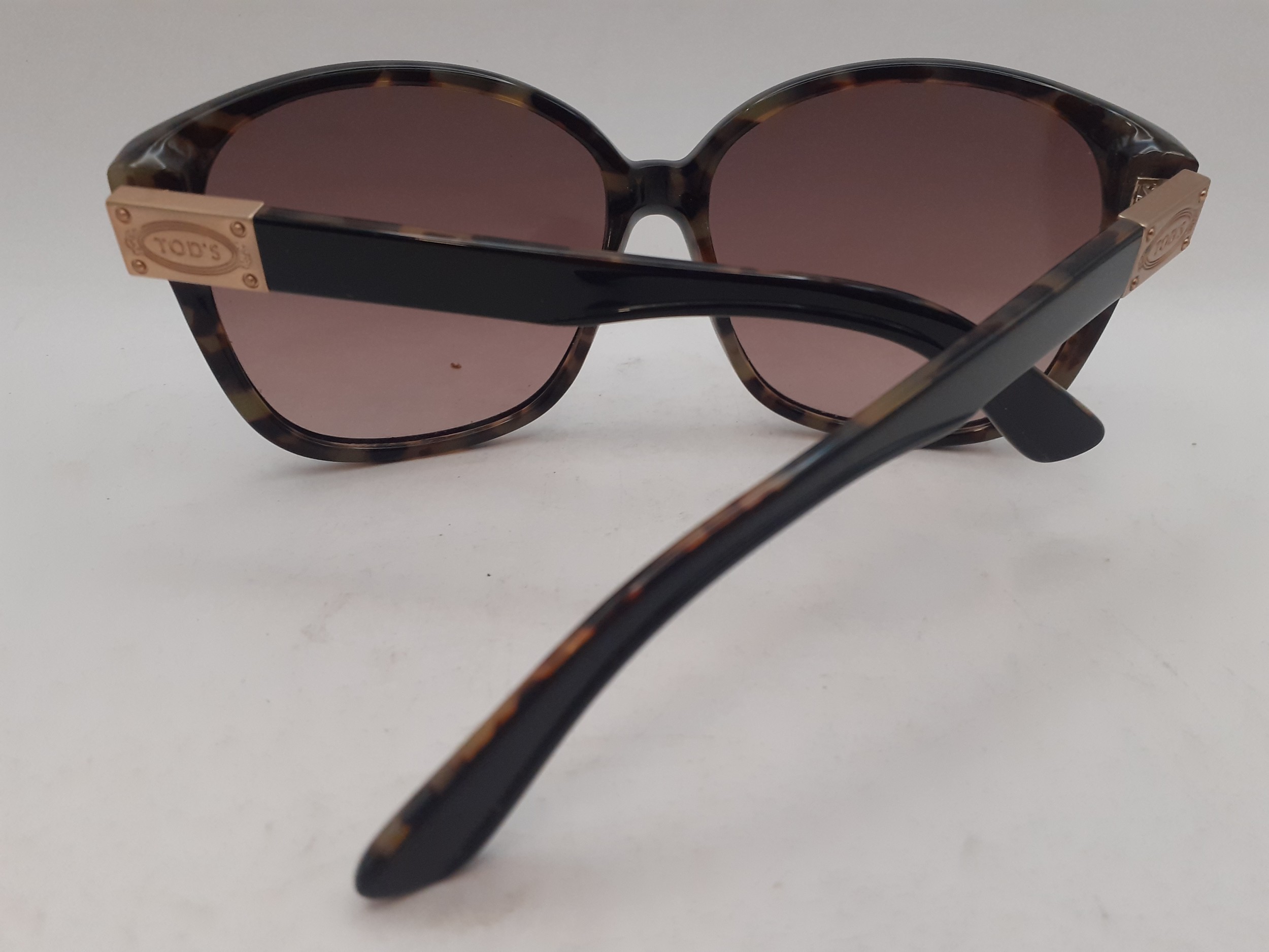 Tods- A pair of brown tortoiseshell effect sunglasses with brown lenses, gold tone branded - Image 3 of 4
