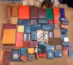 A quantity of small leather and other items to include Filo faxes, wallets, coin purses, spectacle