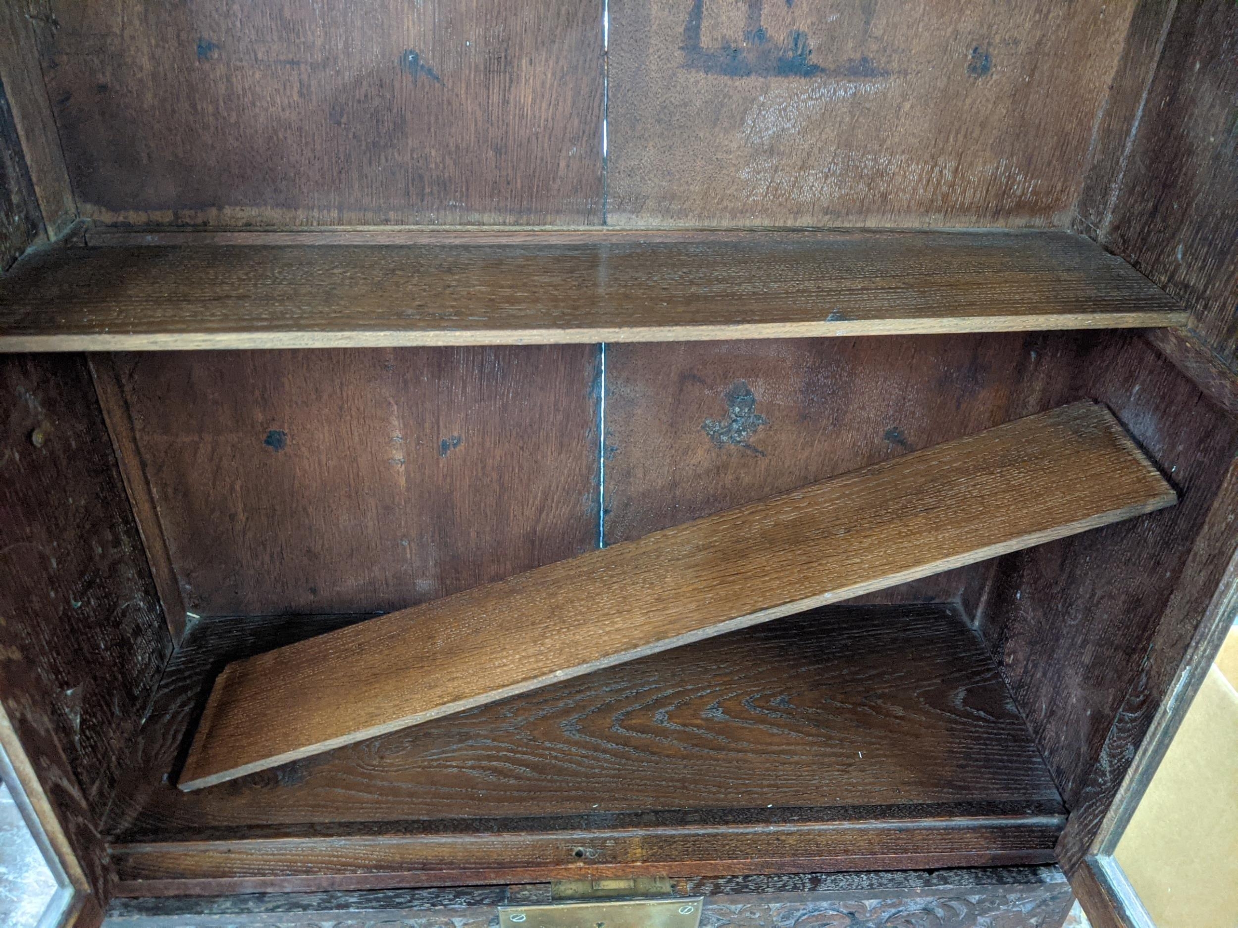 An 18th century and later oak cabinet with twin glazed doors and a carved fall front, 89cm h - Image 4 of 4