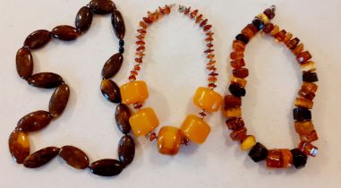 Three vintage amber bead necklaces to include rough-cut beads. Location:BWR