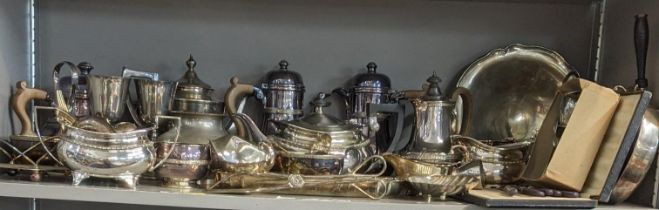 A mixed lot of silver plated items to include a pair of coffee pots, a three footed dish, two tea