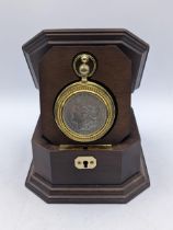 A cased 'Morgan Silver Dollar' Collectors watch by Frank Mint with watch chains and key, housed in a