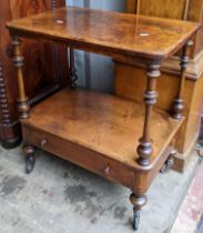 A Victorian walnut veneered two tier what-not having string inlaid, turned columns and a single