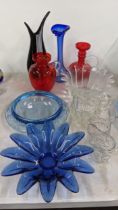 A collection of glass to include a Langham blue and white dish, a green bowl, a clear vase other