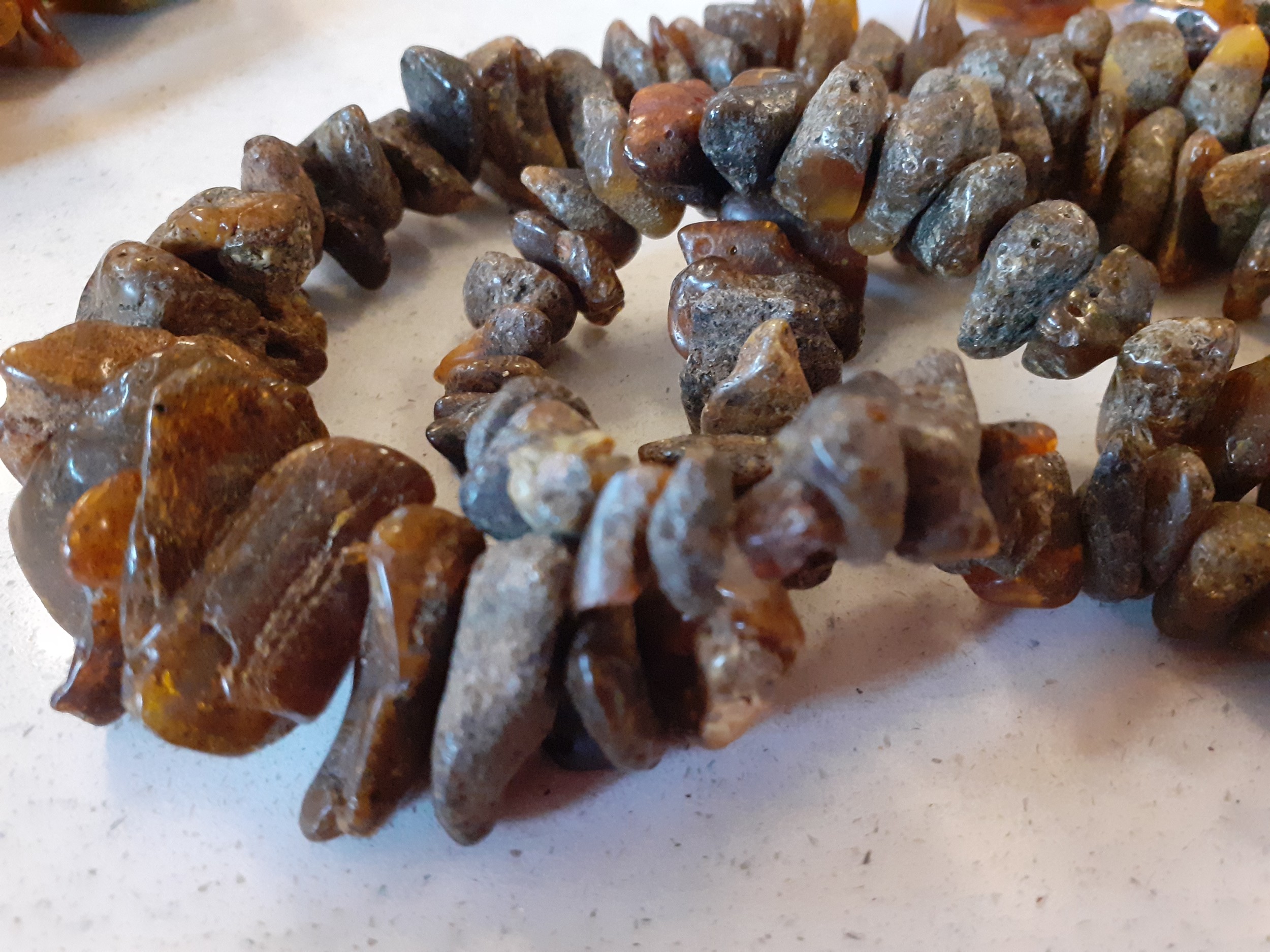 A vintage amber necklace having 15 beads of various sizes and shapes together with 2 vintage rough- - Image 4 of 9