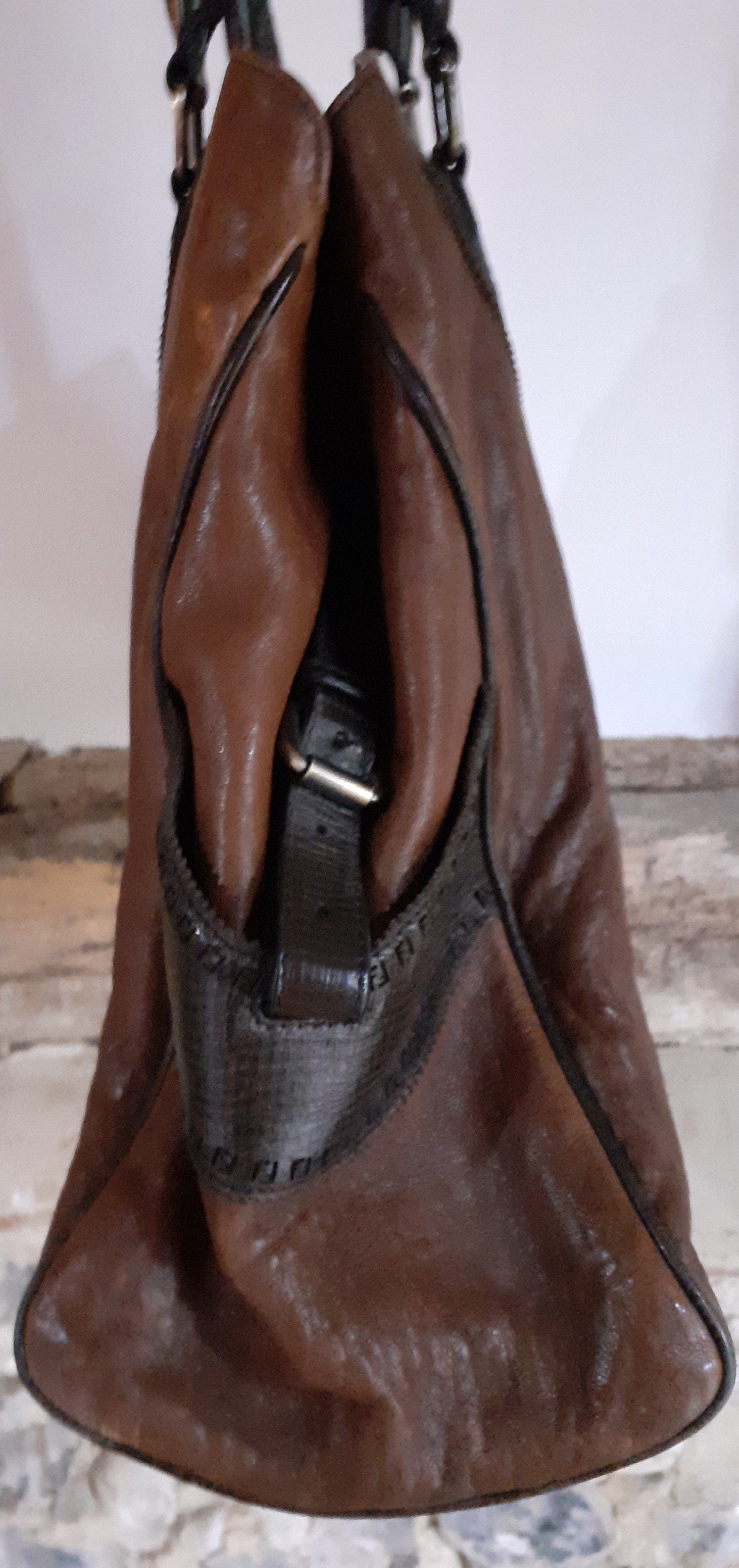 Fendi-A brown leather Selleria boho bag having rolled dark brown leather handles, side pockets, - Image 2 of 6