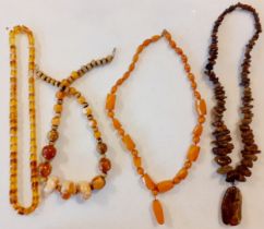 Three vintage amber bead necklaces to include a faceted and roundel orange bead example together