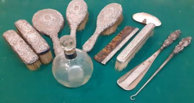 A silver 6 piece dressing table brush/mirror and comb set together with a silver collared glass