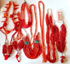 A quantity of vintage red coral costume jewellery to include tribal multi-strand examples and