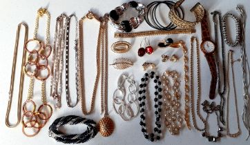 A quantity of modern costume jewellery to include Marks & Spencers necklaces together with a dress
