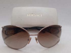 Versace-A pair of gold tone sunglasses with brown ombre lenses, Model 2097, with white branded