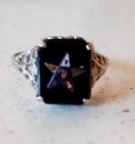 An Art Deco 14 carat white gold and black onyx ring engraved with an Eastern Star pentagram