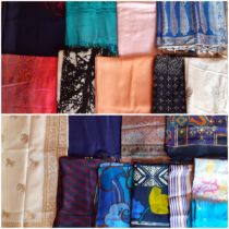 A quantity of Pashminas, wraps and scarves to include silk and Indian inspired examples. Location: