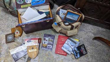 Aviation and RAF related collectables to include a pilots case, Concorde related books, plaques,