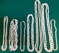 A collection of simulated pearl and seed pearl necklaces to include a simulated strand with silver