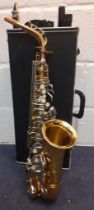 A Century gold tone alto saxophone with silver tone buttons, serial number 875060 having a black