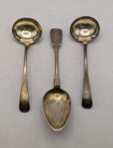 A pair of silver sauce ladles hallmarked London 1810 84.5g together with a silver pattern spoon