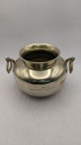 A white metal twin handled pot stamped 900, total weight 406.9g Location: