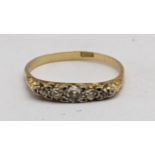 An 18ct gold an five stone diamond ring 2g Location: