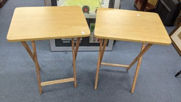 A pair of modern light veneered folding occasional tables, 66cm h x 48.5cm w Location: