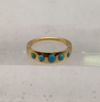 A yellow metal and turquoise ring tested as 18ct gold total weight 3.7g Location: