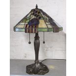 An Art Nouveau style table lamp with a Tiffany style shade Location: