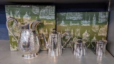 Harrods silver plate to include a three piece tea set and a water jug, boxed Location: