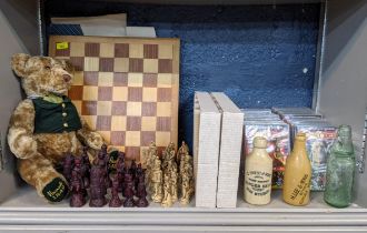 A composition chess set with board, a Harrods teddy and a set of Doctor Who CDs, Location