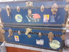 A pair of 1930's steamer trunks having removeable trays and stickers to include hotel and cruise