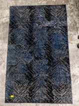 A contemporary abstract design rung in dark blues and black 147x91cm Location: