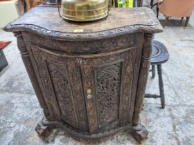 A 20th century Indian carved hardwood chest with twin doors 32 x 71 x 39cm Location: