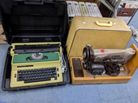 A Silver Reed typewriter and a late 20th century Singer sewing machine, both cased, Location: