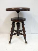 A late 19th century American Holtzman & Sons Columbus Ohio hardwood piano stool, with a height