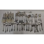 A mixed lot of silver cutlery to include apostle spoons, Georgian caddy spoon, teaspoons and