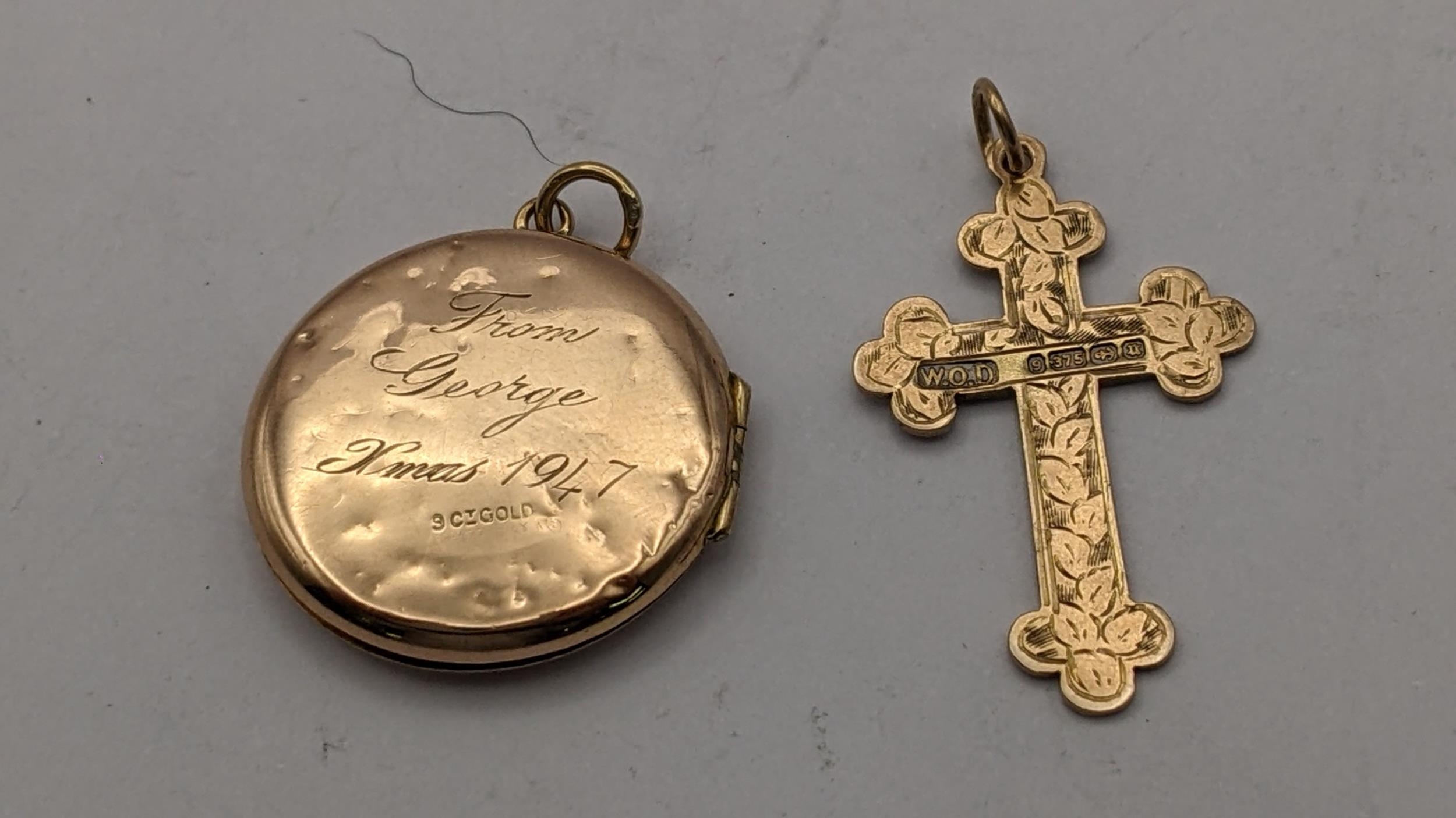A 9ct gold cross pendant, 2.2g, together with a 9ct front and back pendant Location: - Image 2 of 2