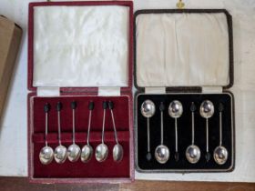 Two sets of six silver coffee bean terminal spoons Location: