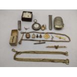 A small quantity of costume jewellery and silver plated items to include a vesta case, a small